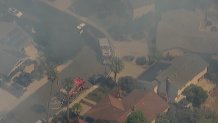 SkyRanger7 showed emergency personnel responding to a wildfire near Del Mar Heights on June 25, 2024. (NBC 7 San Diego)