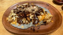 coliflor cubierta de mole sobre tortillas caseras en Carmelita Molino y Cocina. (NBC 7 San Diego)