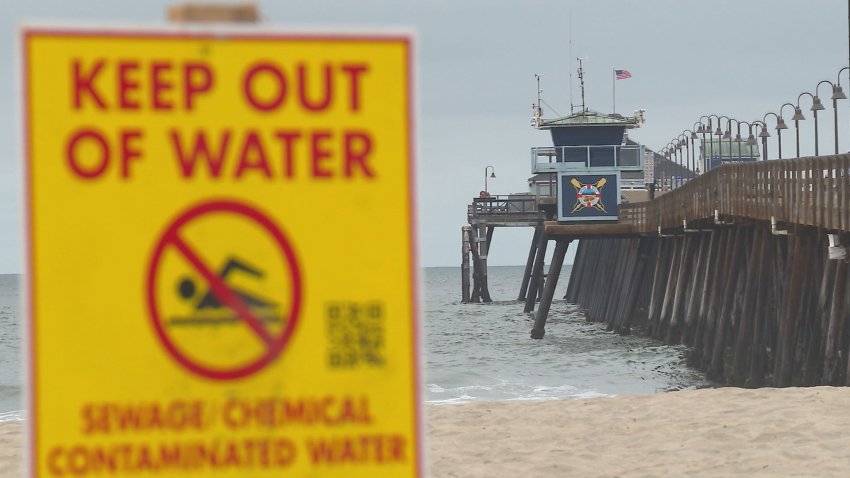 A "Keep out of water" sign is posted in Imperial beach in this undated image.