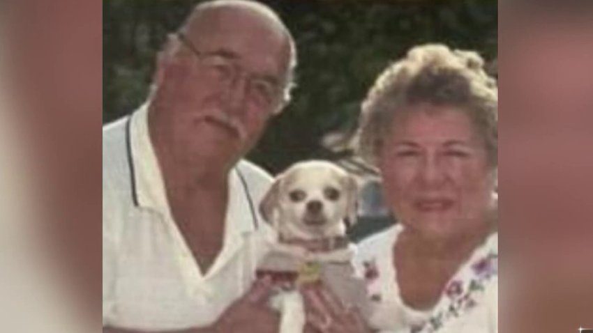 Stephanie and Daniel Menard are pictured with their dog Cuddles in this undated photo.