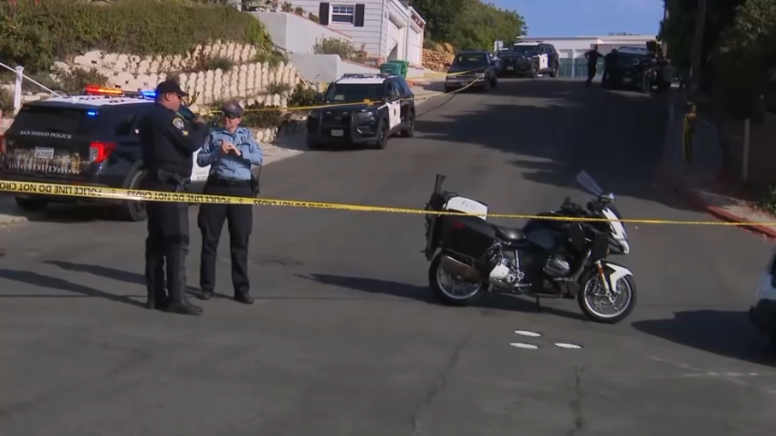 Police officers near the Point Loma shooting scene on Wednesday.