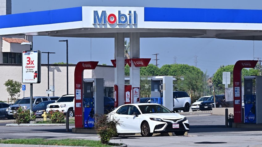 Vehicles pass an ExxonMobil gas station on September 23, 2024 in Rosemead, California. California said Monday it was suing oil giant ExxonMobil over a “decades-long campaign of deception” about plastics recycling that has worsened a global pollution crisis. In a lengthy lawsuit filed in San Francisco, the state’s attorney general said the company had used “slick marketing” to deceive consumers into believing single-use plastics could and would be recycled. (Photo by Frederic J. BROWN / AFP) (Photo by FREDERIC J. BROWN/AFP via Getty Images)