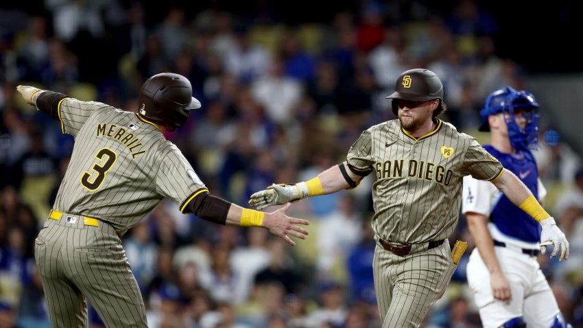 LOS ANGELES, CALIFORNIA – SEPTEMBER 24: Jake Cronenworth #9 of the San Diego Padres celebrates his two run home run with teammate Jackson Merrill #3 during the second inning against the Los Angeles Dodgers at Dodger Stadium on September 24, 2024 in Los Angeles, California. (Photo by Katelyn Mulcahy/Getty Images)