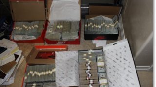 Federal agents found more than $2.4 million in cash hidden in Suel's bedroom, according to prosecutors.