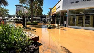 Brown water flooded around some stores in the Westfield UTC mall located in San Diego's University City neighborhood on Sept. 4, 2024. (NBC 7 San Diego)