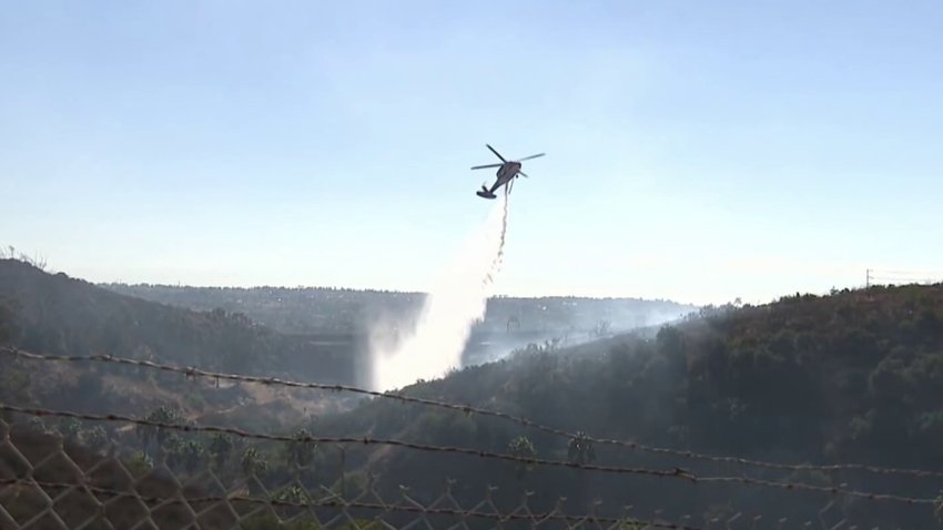 An aircraft making a water drop over the Quarry Fire