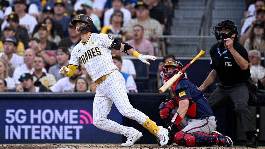 SAN DIEGO, CALIFORNIA – OCTOBER 02: Kyle Higashioka #20 of the San Diego Padres hits a solo home run against Max Fried #54 of the Atlanta Braves during the second inning in Game Two of the Wild Card Series at Petco Park on October 02, 2024 in San Diego, California.  (Photo by Orlando Ramirez/Getty Images)