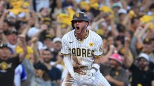 SAN DIEGO, CALIFORNIA - OCTOBER 02: Jackson Merrill #3 of the San Diego Padres celebrates from third base after hitting a two run RBI triple against the Atlanta Braves during the second inning in Game Two of the Wild Card Series at Petco Park on October 02, 2024 in San Diego, California.  (Photo by Sean M. Haffey/Getty Images)