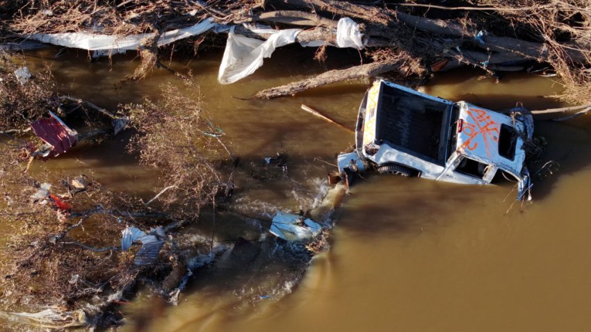 ASHEVILLE, NORTH CAROLINA – OCTOBER 02: An aerial view shows destroyed vehicle in the Swannanoa River in the aftermath of Hurricane Helene flooding on October 2, 2024 in Asheville, North Carolina. President Joe Biden took an aerial tour of the devastated region today and has ordered the deployment of 1,000 active duty U.S. soldiers to assist with storm relief efforts and reinforce the North Carolina National Guard. At least 160 people were killed in six states in the wake of the powerful hurricane which made landfall as a Category 4. (Photo by Mario Tama/Getty Images)