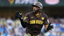 LOS ANGELES, CA - OCTOBER 06: Fernando Tatis Jr. #23 of the San Diego Padres celebrates after hitting a solo home run in the first inning during Game 2 of the Division Series presented by Booking.com between the San Diego Padres and the Los Angeles Dodgers at Dodger Stadium on Sunday, October 6, 2024 in Los Angeles, California. (Photo by Daniel Shirey/MLB Photos via Getty Images)