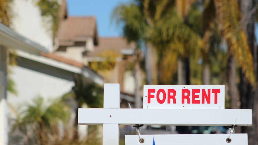 Close up of a “For Rent” sign in a typical Southern California neighborhood