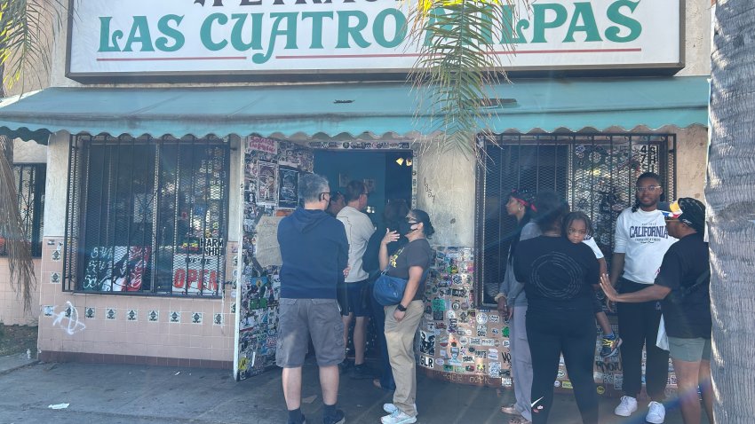 Folks line up outside for Mexican food at Las Cuatro Milpas in San Diego's Barrio Logan neighborhood on Oct. 25, 2024. (NBC 7 San Diego)