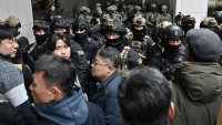 Soldiers try to enter the National Assembly building in Seoul on December 4 2024, after South Korea President Yoon Suk Yeol declared martial law. South Korea’s President Yoon Suk Yeol on December 3 declared martial law, accusing the opposition of being “anti-state forces” and saying he was acting to protect the country from “threats” posed by the North. (Photo by Jung Yeon-je / AFP) (Photo by JUNG YEON-JE/AFP via Getty Images)