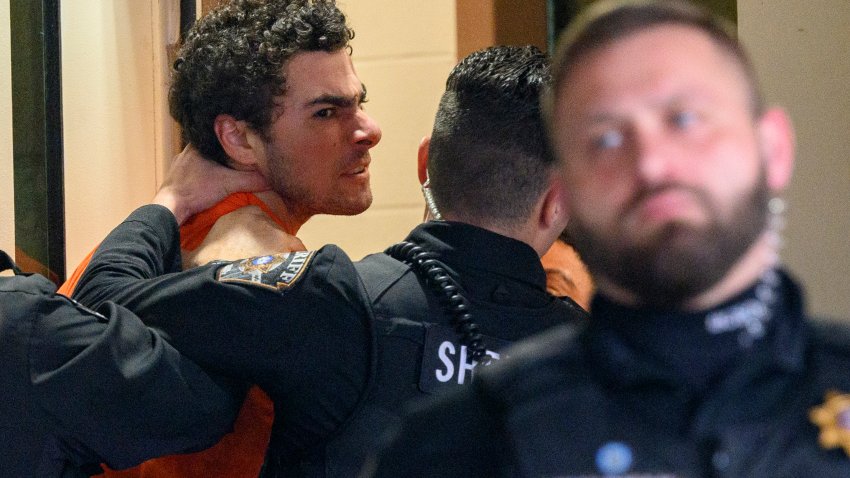 HOLLIDAYSBURG, PENNSYLVANIA – DECEMBER 10: Suspected shooter Luigi Mangione is led into the Blair County Courthouse for an extradition hearing December 10, 2024 in Hollidaysburg, Pennsylvania. Mangione has been arraigned on weapons and false identification charges related to the fatal shooting of United Healthcare CEO Brian Thompson in New York City. Mangione is incarcerated in the State Correctional Institution in Huntingdon, Pennsylvania awaiting extradition to New York.