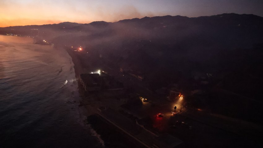 MALIBU, CALIFORNIA – JANUARY 09: In an aerial view, buildings experience a power outage and damage from the Palisades Fire on January 09, 2025 in Malibu, California. As of this morning, Los Angeles Department of Water and Power reported 94,000 customers remaining without power in the region. Multiple wildfires fueled by intense Santa Ana Winds are burning across Los Angeles County. At least five people have been killed, and over 25,000 acres have burned. Over 2,000 structures have also burned and almost 180,000 people are under orders to evacuate. (Photo by Mario Tama/Getty Images)