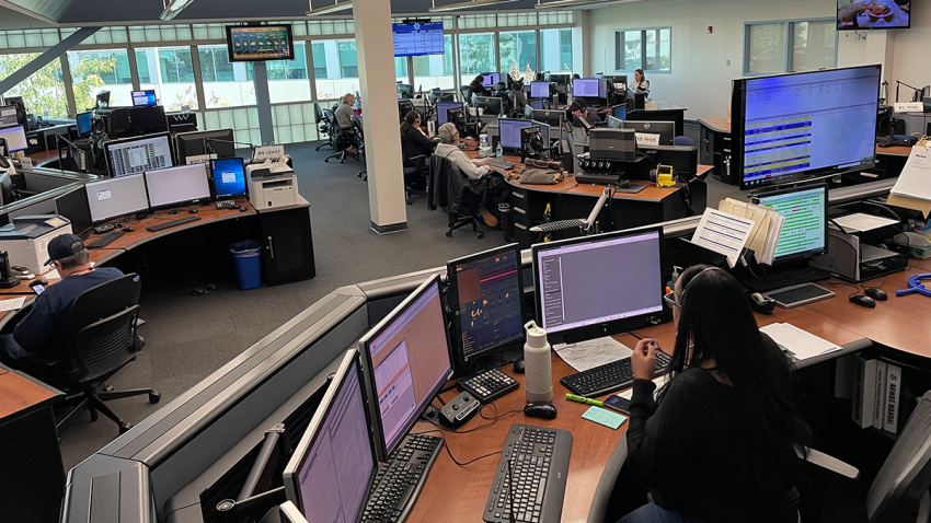 Dispatchers answer 911 calls at the San Diego County Sheriff's Office.