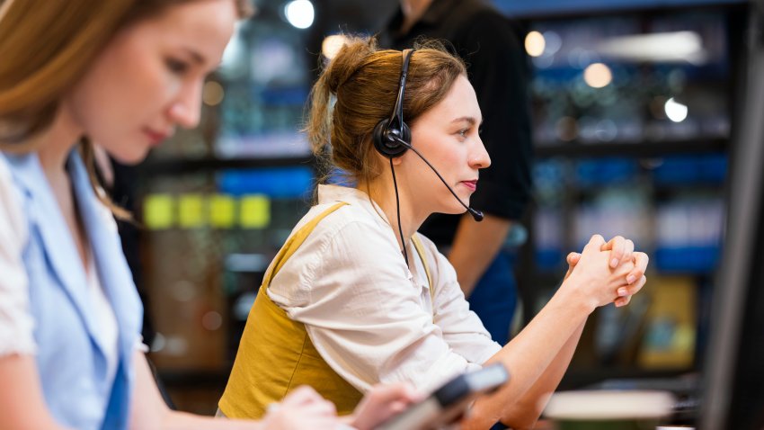 It‚Äôs My Pleasure to Be of Assistance. Side View of a Technical Support Teams working in a tech office while supporting product technical to customers over the phone to increase customer satisfaction.