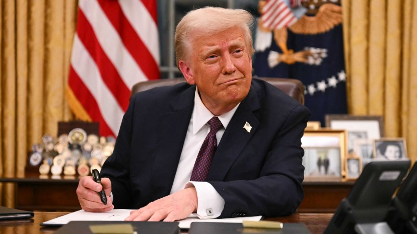 TOPSHOT – US President Donald Trump signs executive orders in the Oval Office of the White House in Washington, DC, on January 20, 2025. (Photo by Jim WATSON / AFP) (Photo by JIM WATSON/AFP via Getty Images)