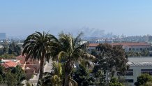 A photo from Point Loma shows a plume of smoke rising over Coronado on Feb. 21, 2025.
