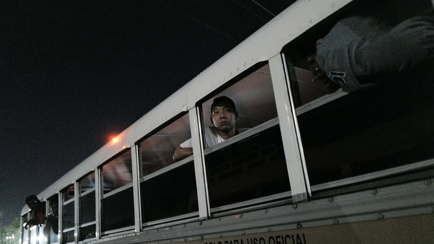 Migrants arrive at the Albrook bus station after obtaining a permit to leave the San Vicente shelter in Panama city on March 8, 2025. Panama announced on March 7, 2025, it will grant 30-day permits to 112 migrants deported from the US, most of them Asians, to leave the shelter where they are being held to apply for visas. (Photo by MAURICIO VALENZUELA / AFP) (Photo by MAURICIO VALENZUELA/AFP via Getty Images)