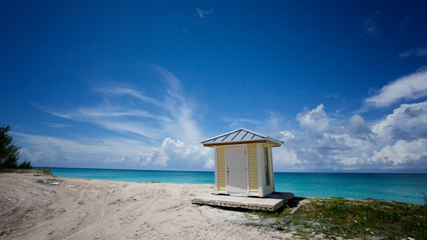 a yellow hut sits on the beach near the spot where Resorts World Bimini is planning to build a 1,000 foot long dock for their ship