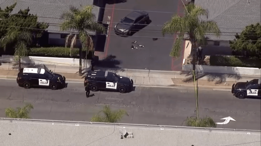 Police cars seen in El Cajon on Thursday after a shooting.