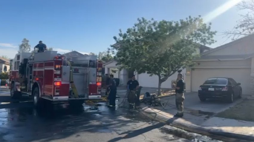 firefighters outside a home