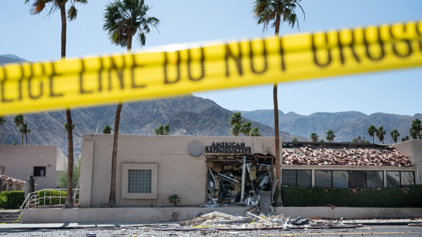 A police line is seen outside a damaged American Reproductive Centers fertility clinic after a bomb blast outside the building in Palm Springs, California, on May 17, 2025. A bomb blast outside a California fertility clinic killed one person Saturday, in what the US attorney general called an “unforgivable” attack. The blast ripped through downtown Palm Springs, badly damaging the clinic and blowing out the windows and doors of other nearby buildings. (Photo by Gabriel Osorio / AFP) (Photo by GABRIEL OSORIO/AFP via Getty Images)