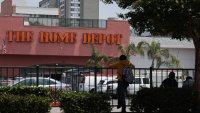People wait outside of a Home Depot store on Wilshire Blvd that was previously the site of Immigration and Customs Enforcement (ICE) detention of day laborers in the Westlake MacArthur Park neighborhood of Los Angeles, California, on June 11, 2025. Protests against Donald Trump’s harsh immigration policies spread on June 11 across the United States despite a military-backed crackdown in Los Angeles and a threat by the Republican president to use “heavy force.” In Los Angeles, where the unrest began, an overnight curfew in the downtown area saw police make 25 arrests by morning. (Photo by Patrick T. Fallon / AFP) (Photo by PATRICK T. FALLON/AFP via Getty Images)