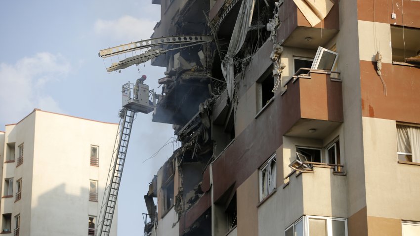 A view of a damaged building in the Iranian capital, Tehran, following an Israeli attack, on June 13, 2025. Firefighting teams are dispatched to the area. Israeli Defense Minister Israel Katz has announced that Israel conducted strikes on Iran.