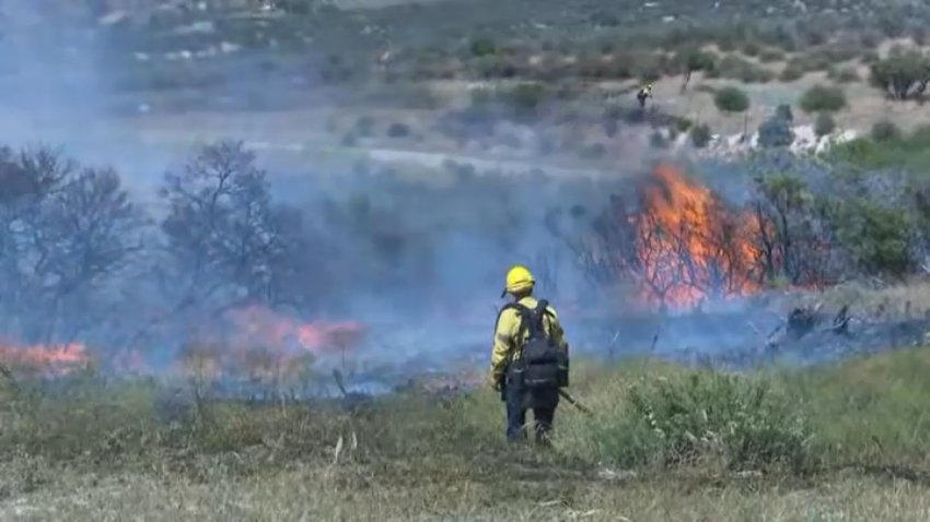 A wildfire driven by wind led to evacuations and the closure of I-8 near Campo on Tuesday, May 19.