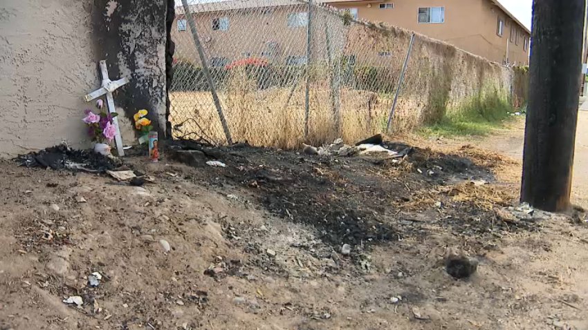 A scorched area of the Mountain View neighborhood in San Diego shows where an encampment fire killed a man on June 28, 2026. (NBC 7 San Diego)