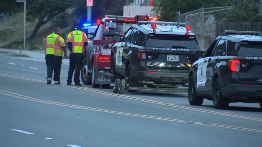 A police vehicle being towed away from the scene of a deadly pedestrian crash on June 17, 2026.