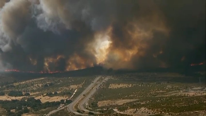 Smoke fills the air from a wildfire over the I-8 near Campo, July 15, 2026.