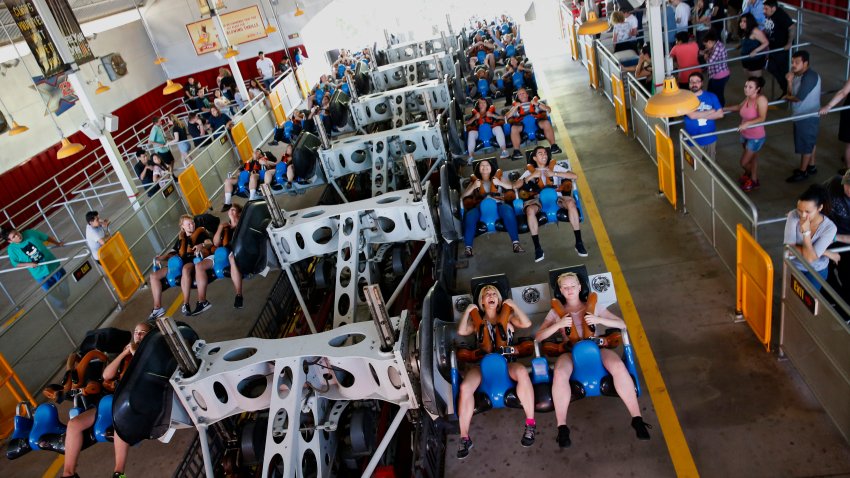 Visitors prepare to ride the X2 roller coaster at Six Flags Magic Mountain in Valencia.