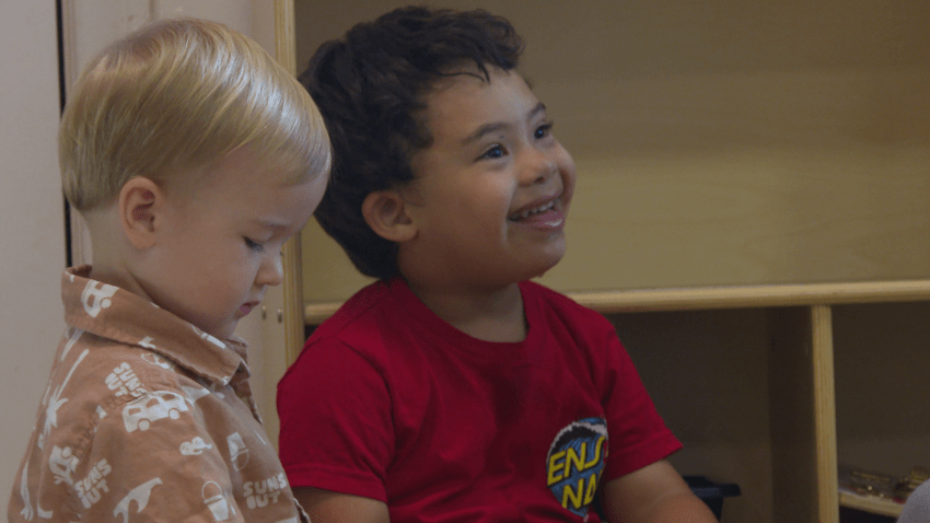 Two little boys in a classroom.